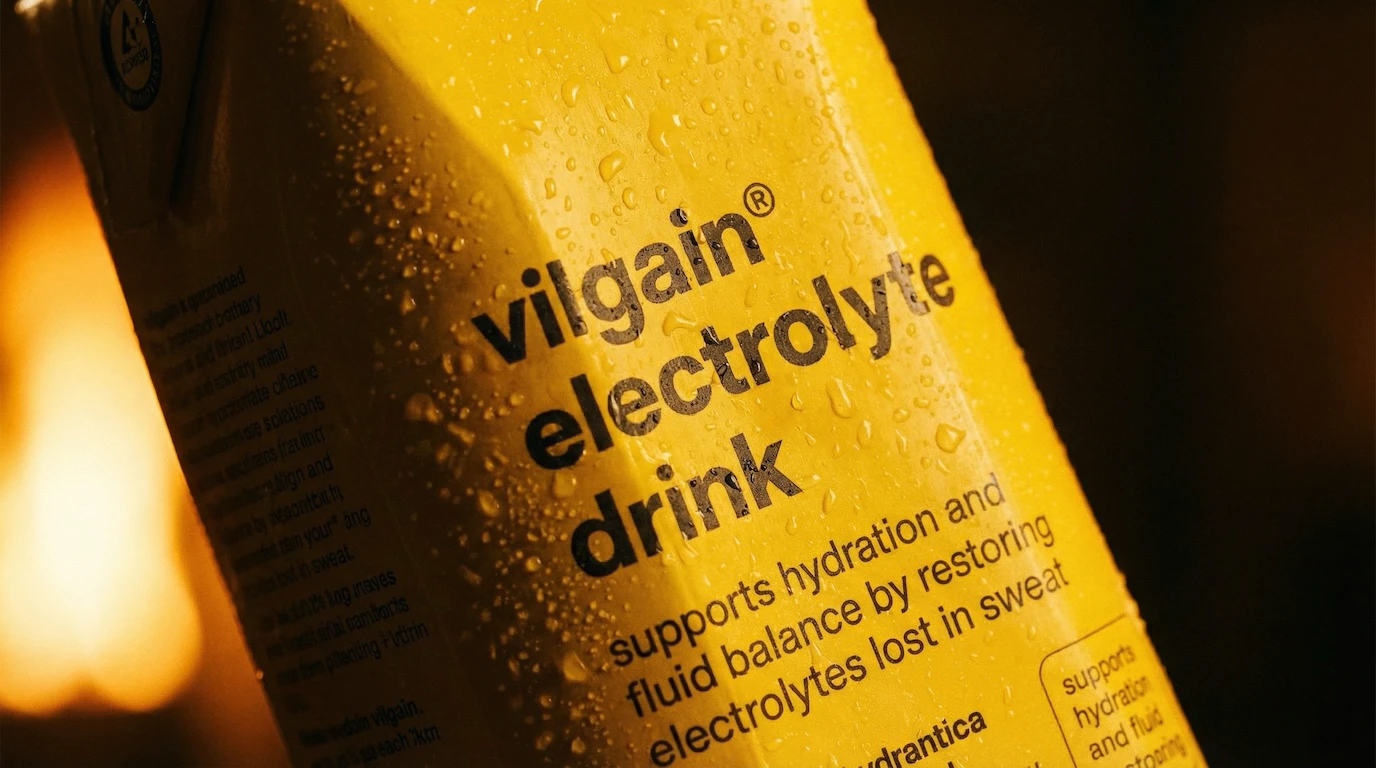 Two electrolyte drink cartons with dramatic diagonal shadows