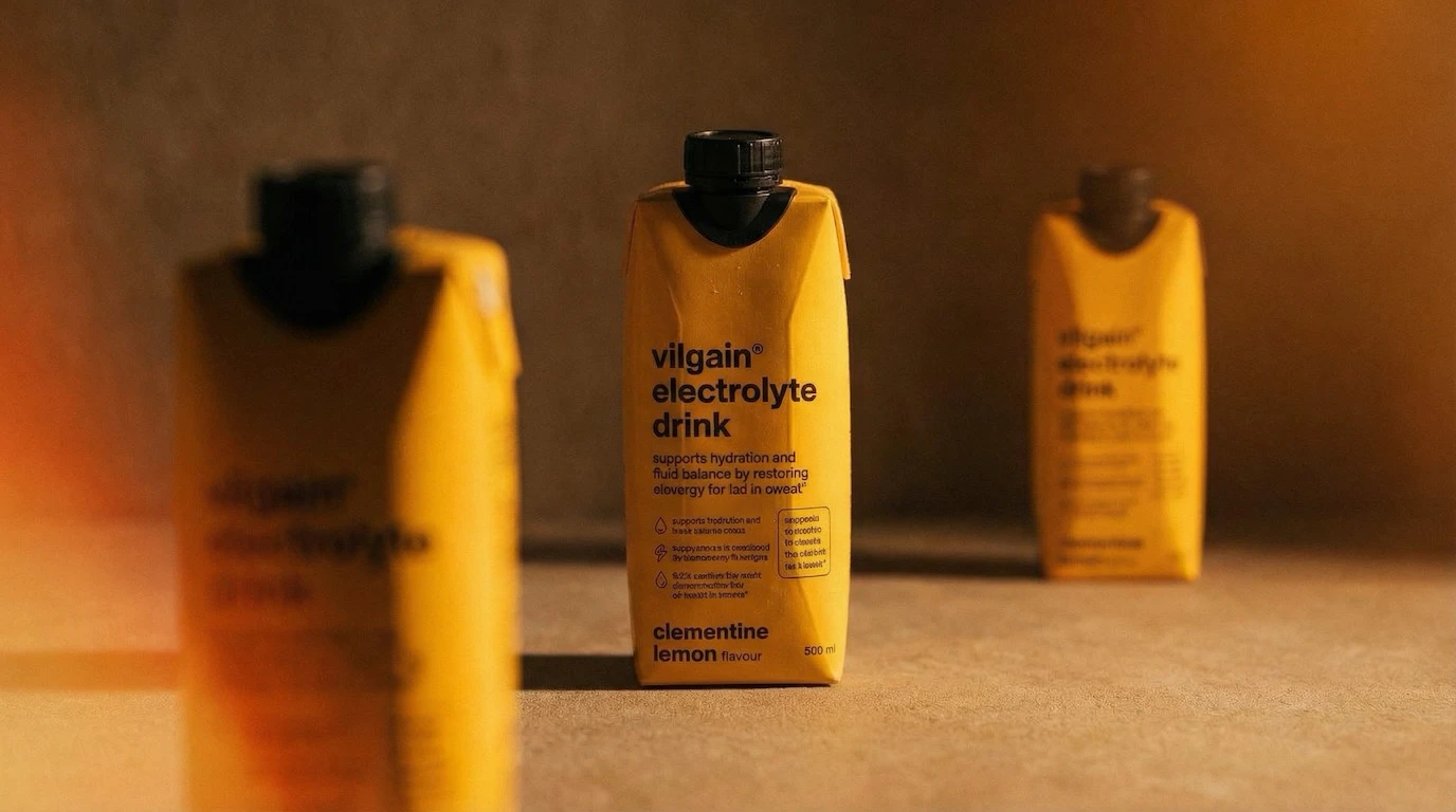 Three electrolyte drink cartons in warm moody studio lighting